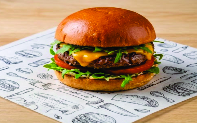 Gourmet Burger envuelta en papel antigrasa biodegradable de JuanImprime Cali